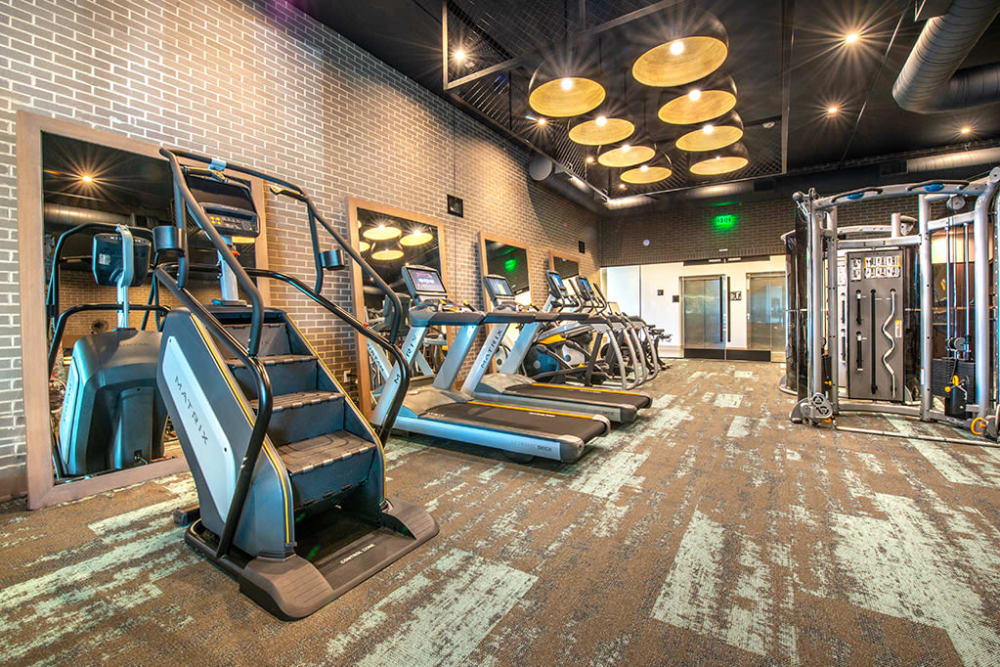 Modern fitness center with plenty of room and equipment at Indie Deep Ellum in Dallas, Texas