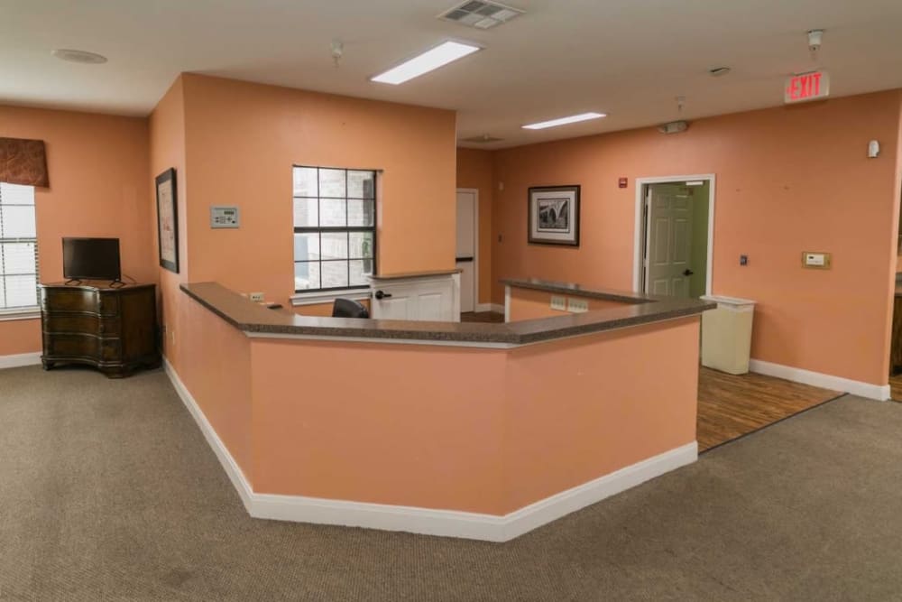Cheerful peach front desk at RockBrook Memory Care in Lewisville, Texas