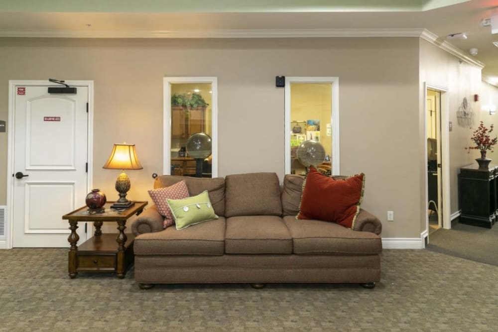 Cheerful sofa with lamp at Lakeshore Assisted Living and Memory Care in Rockwall, Texas