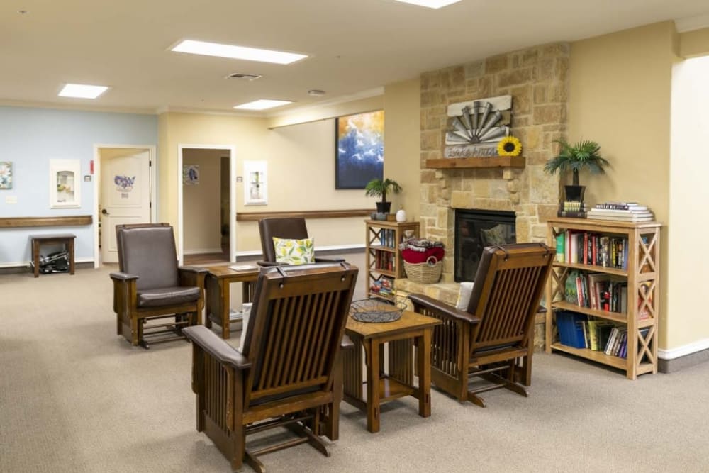 Sitting area with bookshelf at Lakeshore Assisted Living and Memory Care in Rockwall, Texas