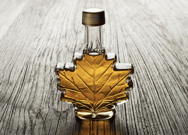 Maple syrup in a Maple leaf shaped glass bottle