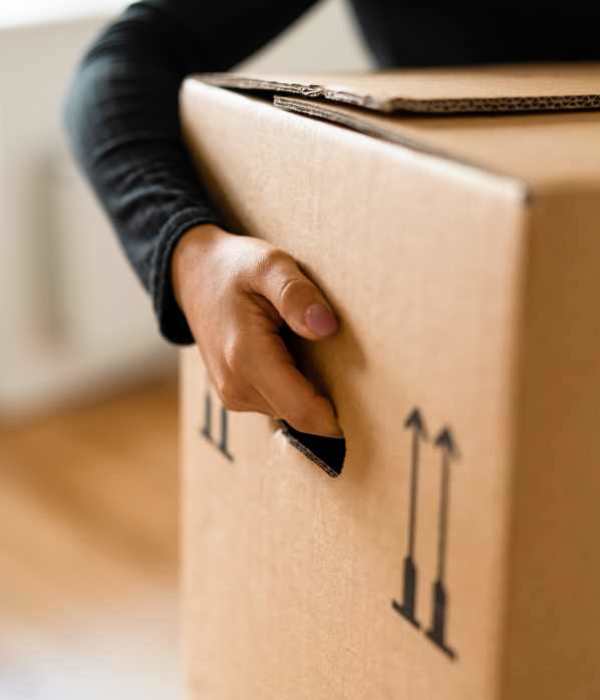 A customer holding a packed box at Storage Hub - Yale in Tulsa, Oklahoma