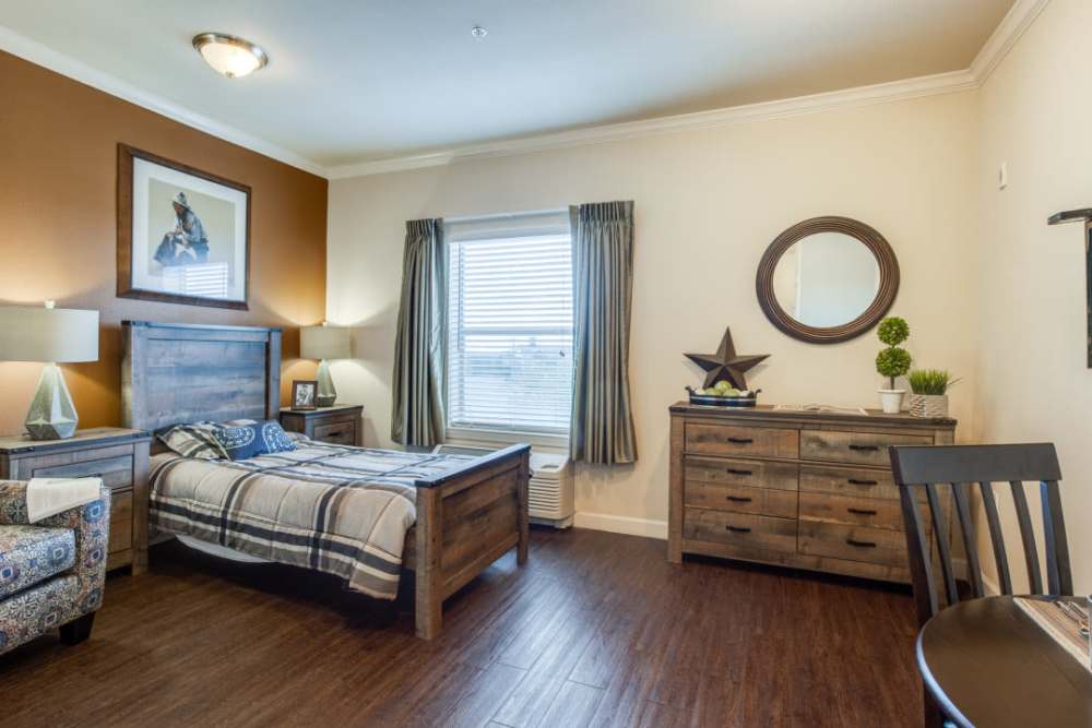 A large bed in a bedroom at Isle at Cedar Ridge in Cedar Park, Texas