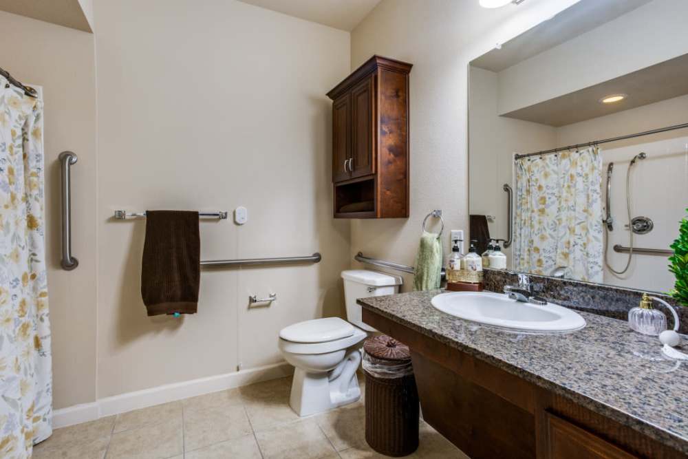 A large bed in a bedroom at Isle at Cedar Ridge in Cedar Park, Texas