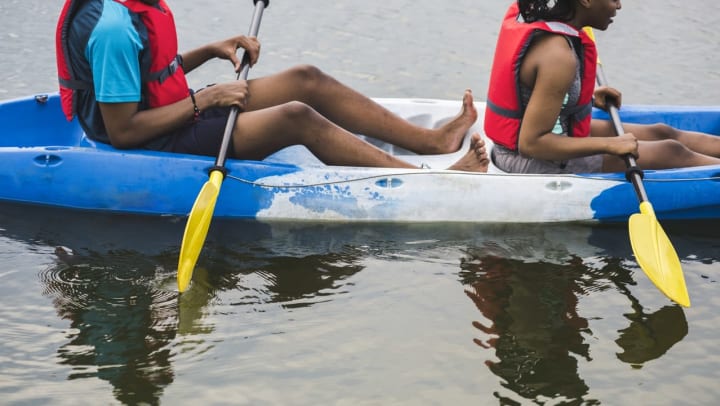 Residents enjoying kayaking near Olympus Woodbridge in Sachse, Texas.
