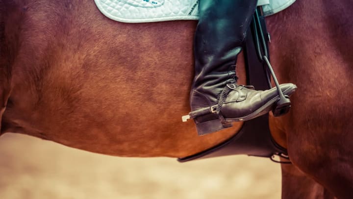 Resident enjoying horseback riding lessons near Olympus Woodbridge in Sachse, Texas.