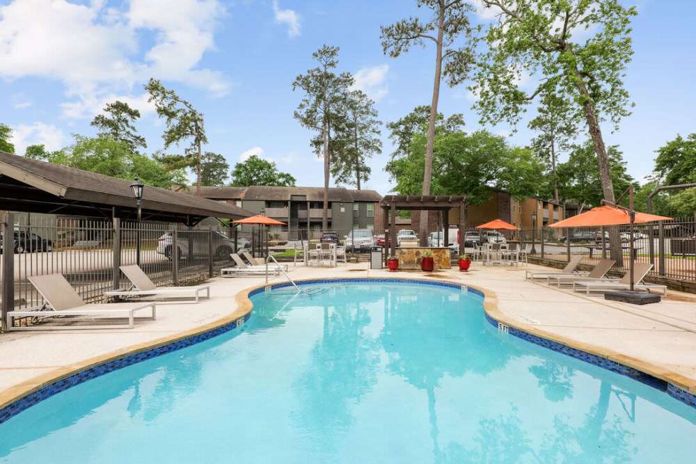 Pool with outdoor grill station  at Lexington in The Woodlands, Texas