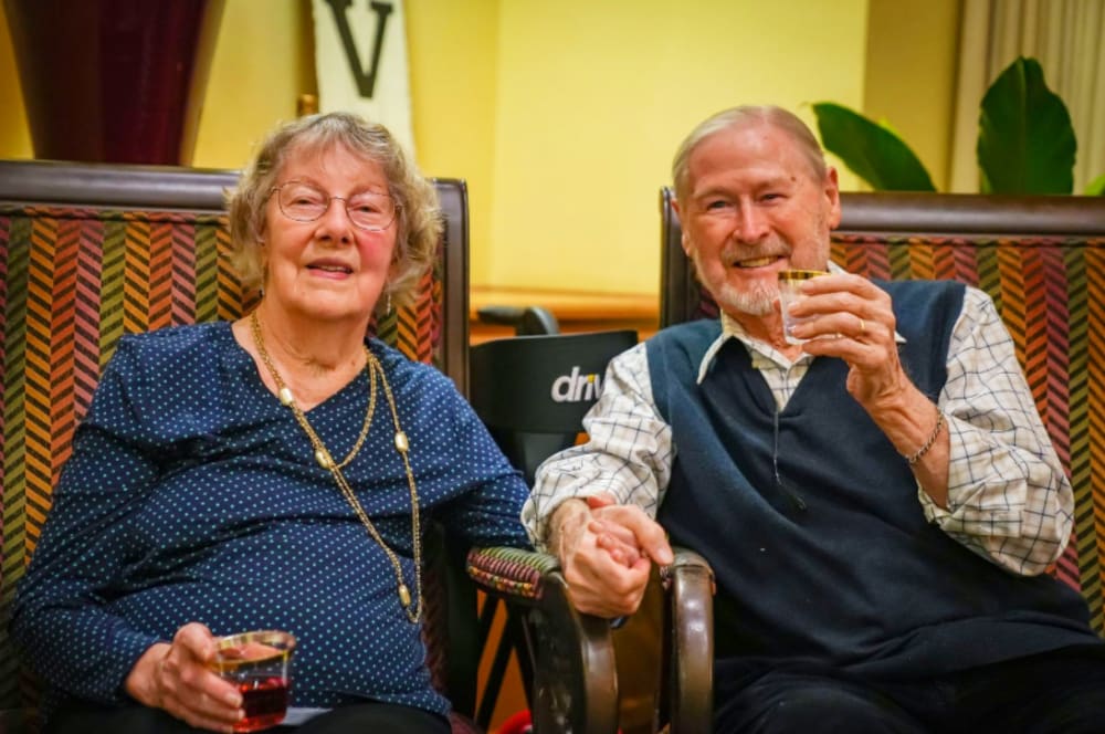 Residents enjoying a glass of wine at Winding Commons Senior Living in Carmichael, California