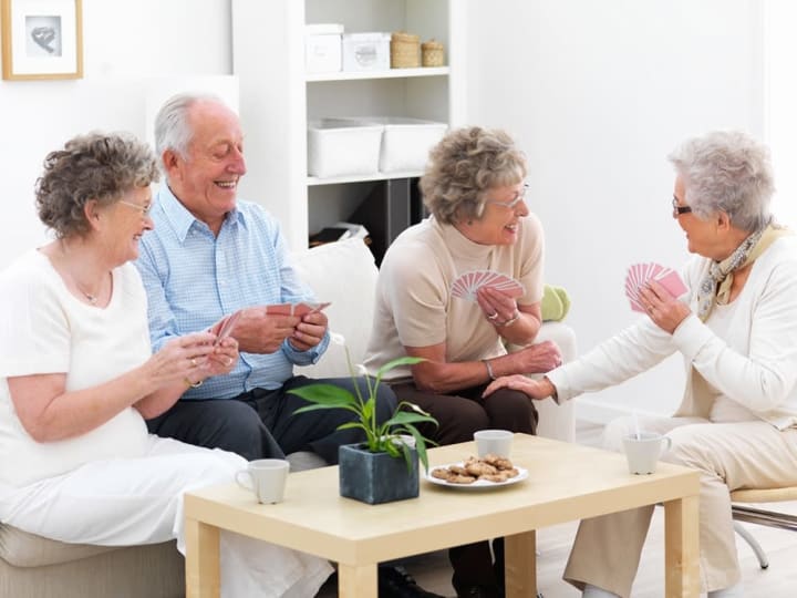 Residents playing cards together.