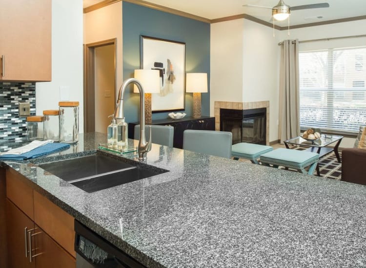View of living area from model home's kitchen in open-concept floor plan at Presley Oaks in Charlotte, North Carolina