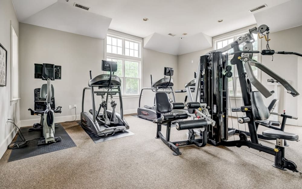 Well-equipped fitness center with cardio equipment at Falls Creek Apartments & Townhomes in Raleigh, North Carolina