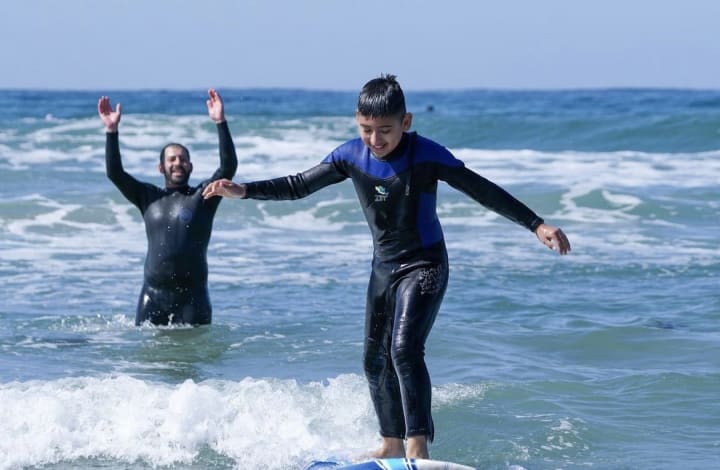 A Boy Surfing