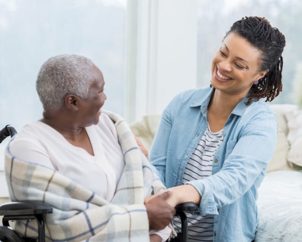 Family visits resident in apartment at The Preserve of Roseville in Roseville, Minnesota.