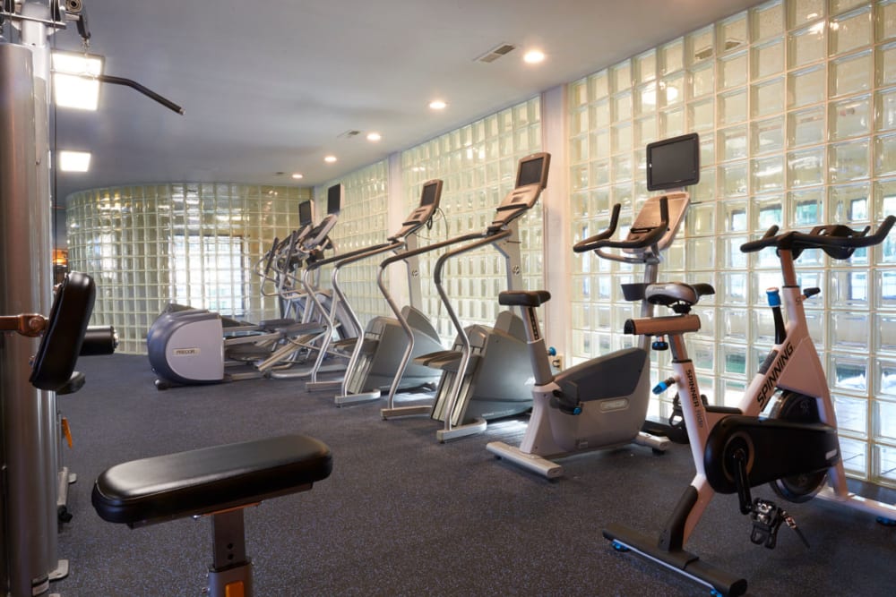 Fitness center with cardio equipment and spin bike at Muirwood in Farmington Hills, Michigan