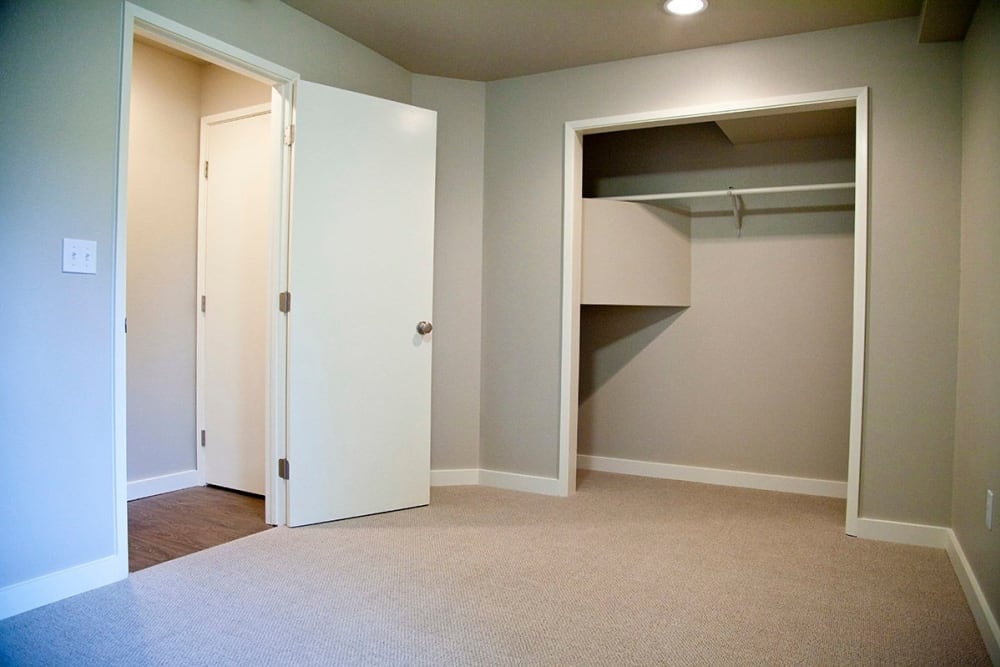 Bedroom with a spacious closet at Beach Court Apartments in Seattle, Washington