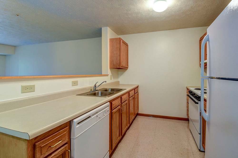 Kitchen with white appliances at Providence Greene I in Wheeling,West Virginia