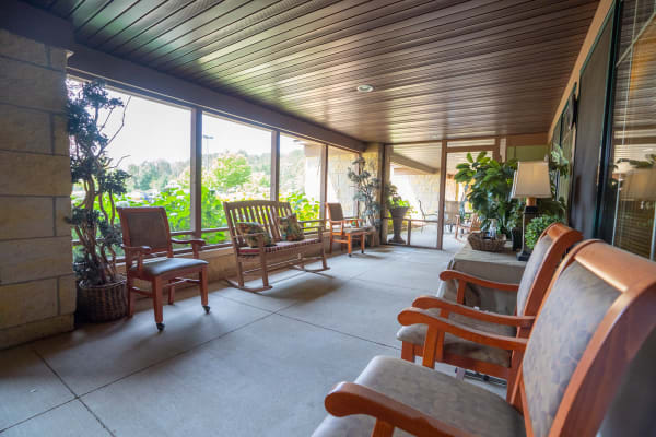 Screened in porch with large chairs at at Meadows on Fairview in Wyoming, Minnesota