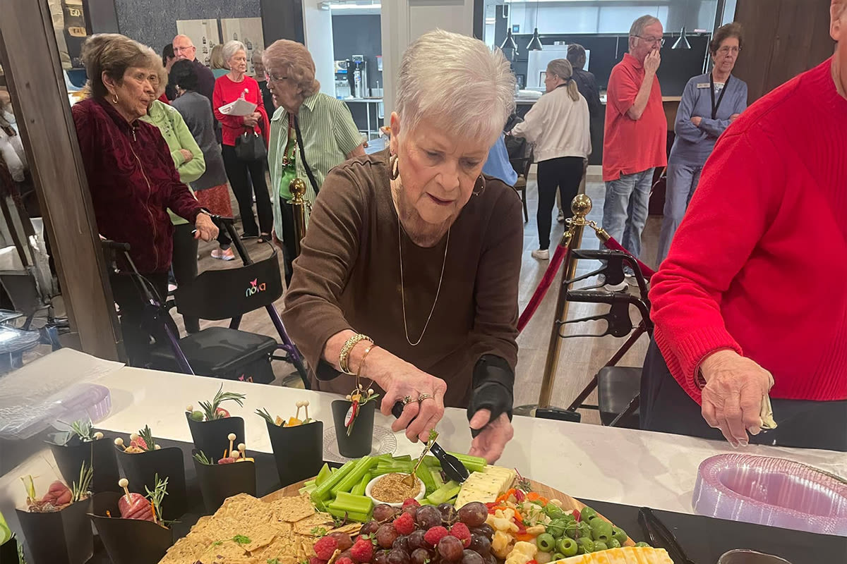 Resident choosing from a menu at Watermere at the Preserve in North Richland Hills, Texas