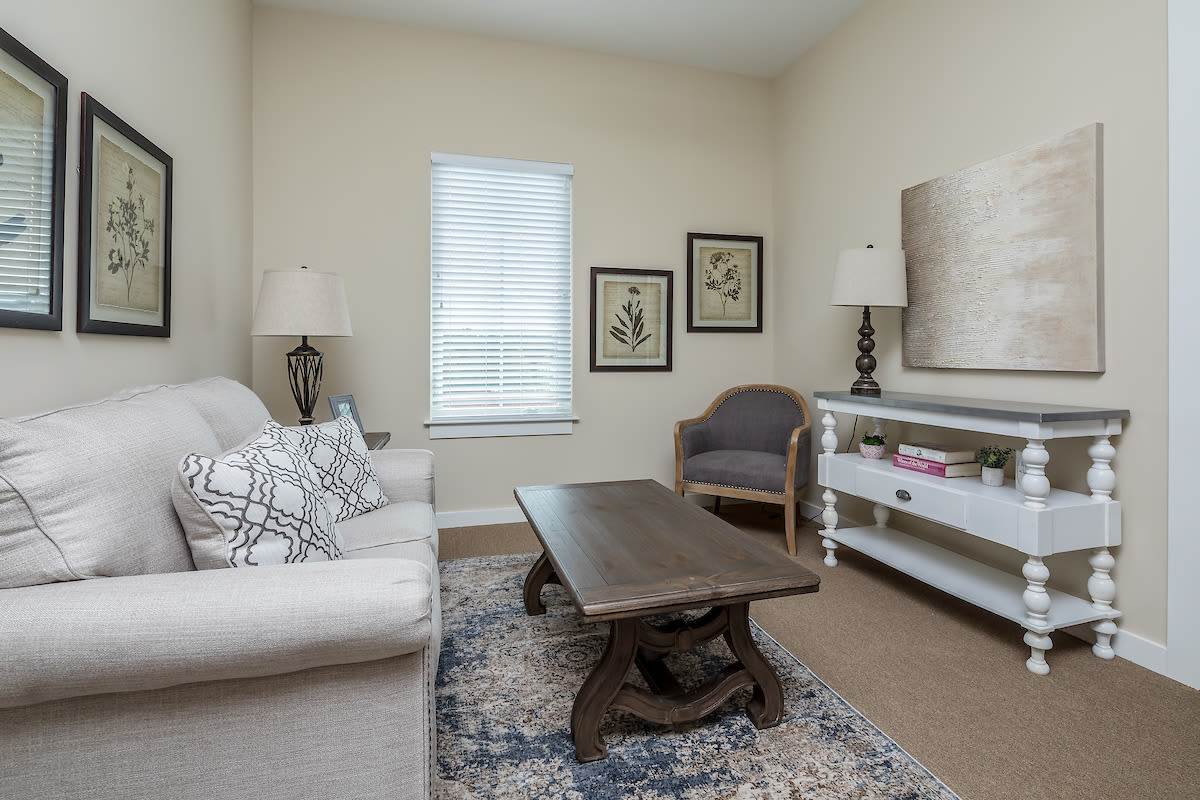 A spacious resident living room at The Claiborne at Gulfport Highlands in Gulfport, Mississippi.