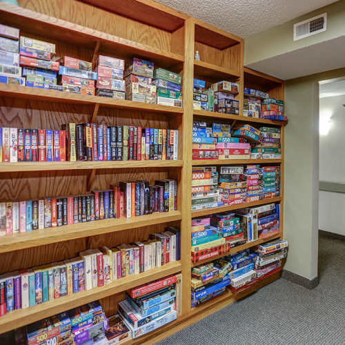 Bookshelves filled with various board games at Laurelhurst in Clyde, Ohio