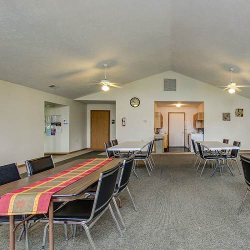 Tables and chairs in a community room at Wellington Place in Ottawa, Ohio