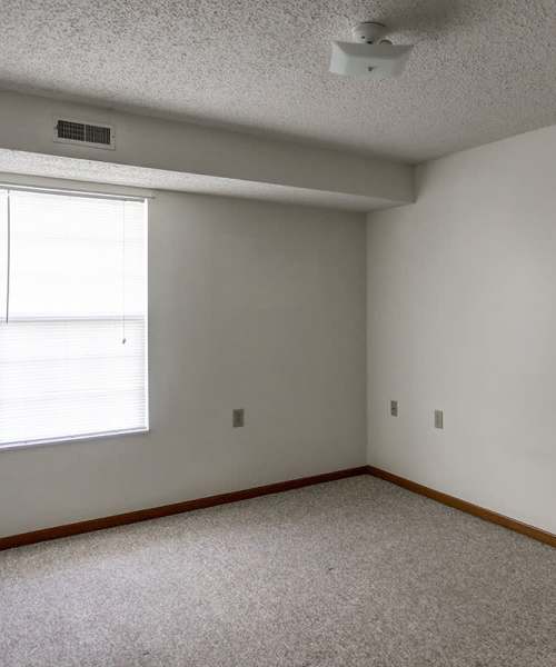 Window with blinds in empty room at Laurelhurst in Clyde, Ohio
