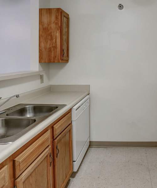 Double sink with wooden cabinets at Laurelhurst in Clyde, Ohio