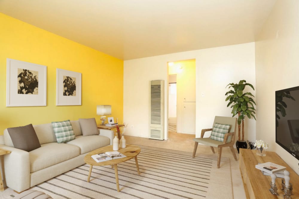 Model living room at Coral Gardens Apartment Homes in Hayward, California
