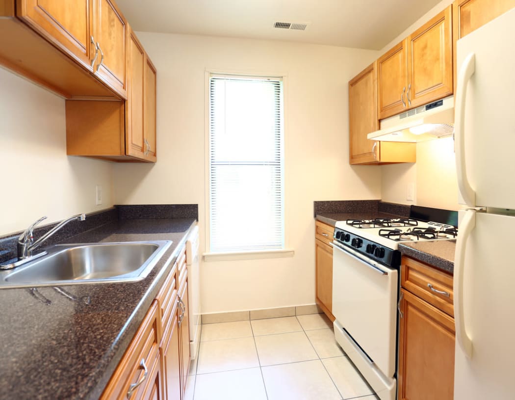 Modern kitchen with a stainless-steel sink at Laurel Hill Apartments in Lindenwold, New Jersey