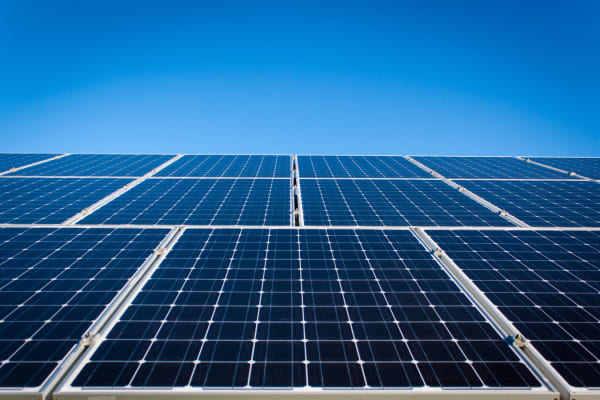 Solar panels under clear blue sky at The Canopy Apartment Villas in Orlando, Florida
