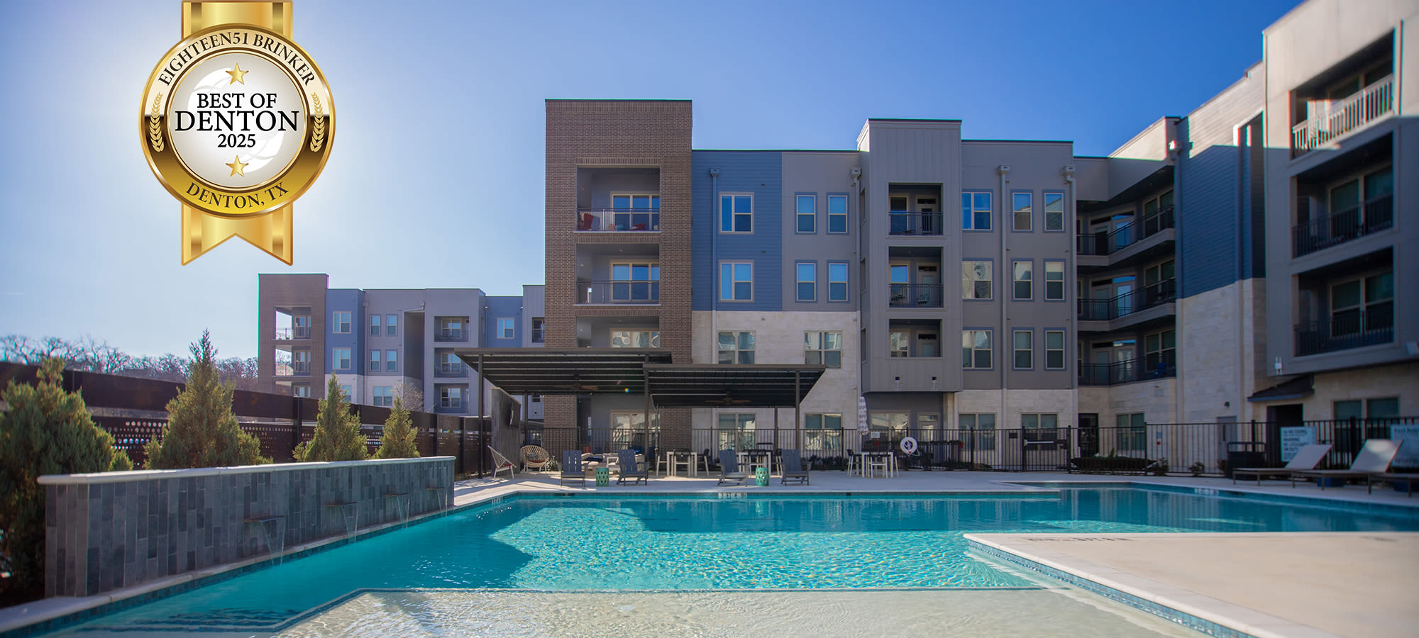 Exterior Shot of Pool and building at Eighteen51 Brinker