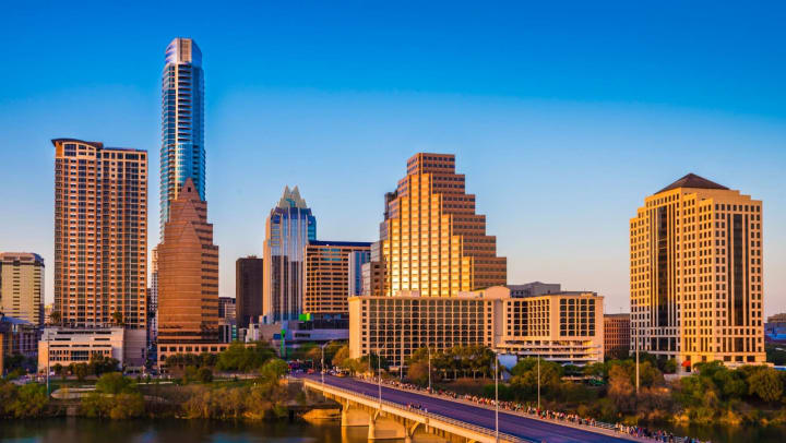 Austin, Texas, cityscape skyline panorama, Congress Avenue Bridge, late afternoon