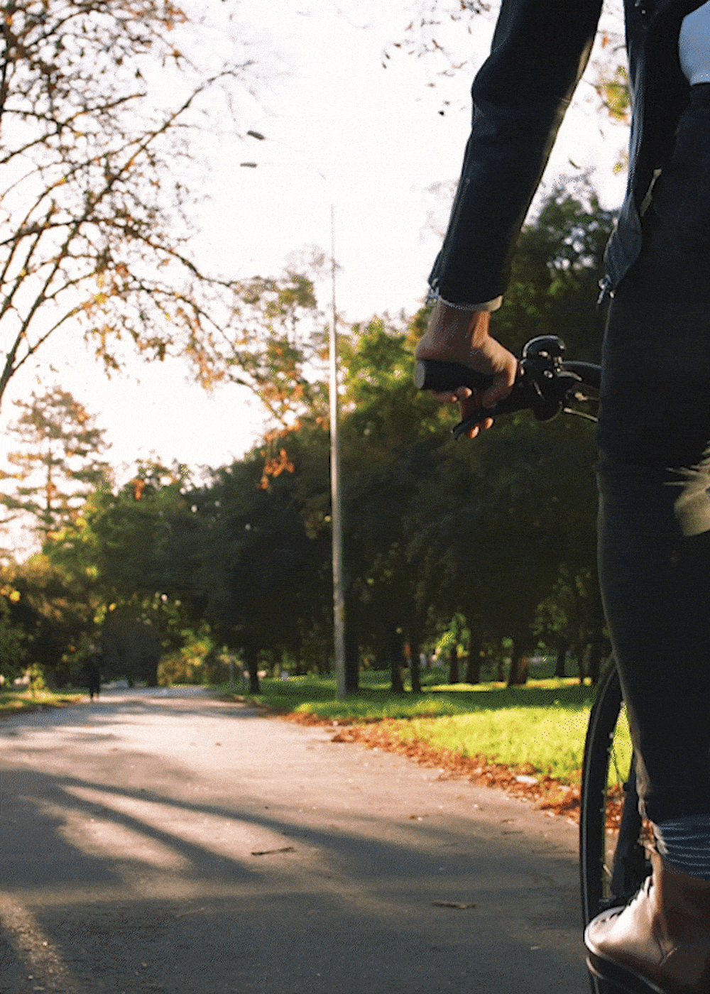 GIF of a resident riding a bike near Harborside Marina Bay Apartments in Marina del Rey, California
