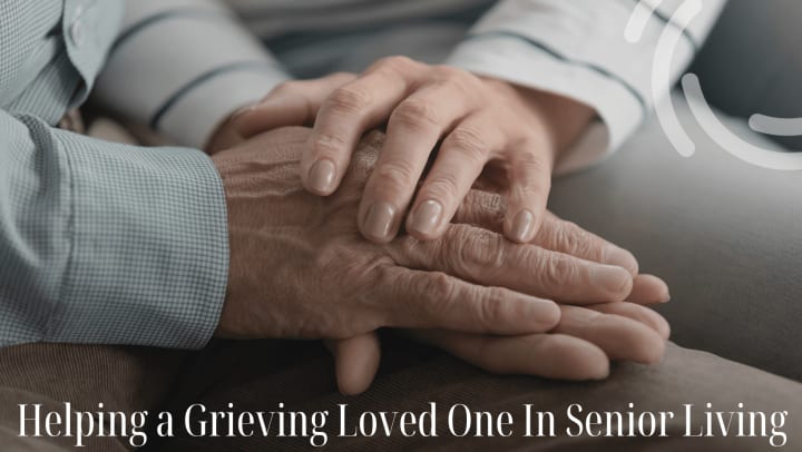 Seniors comforting each other holding hands