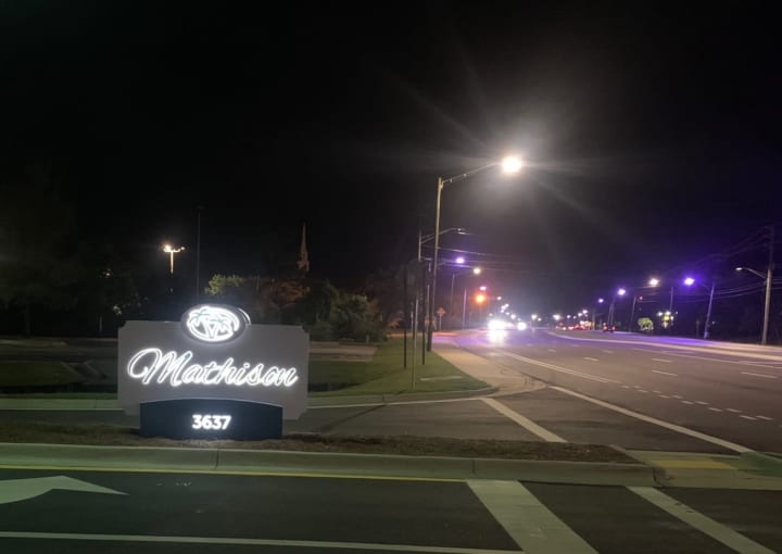 Mathison's Entryway Sign Lit Up At Night