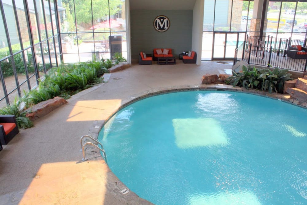 Indoor swimming pool with vegetation at Goldelm at Metropolitan in Knoxville, Tennessee