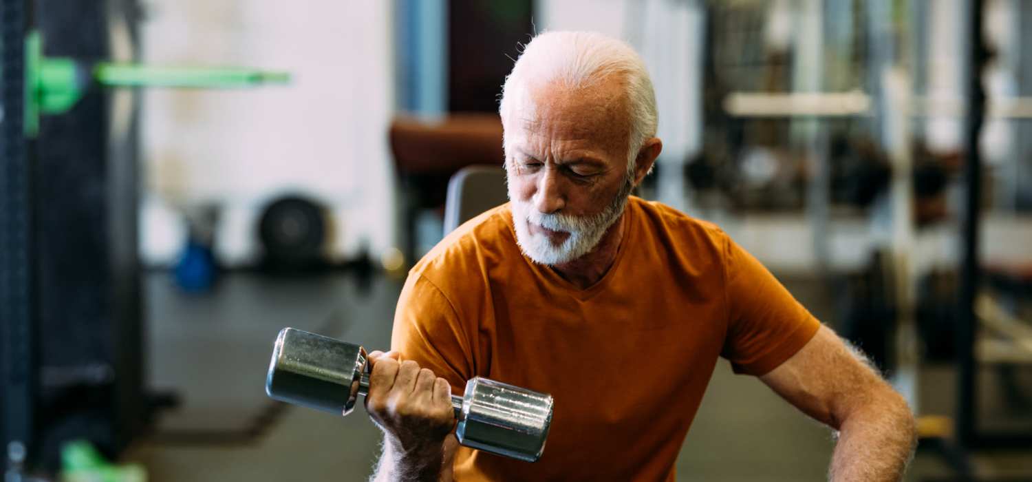 Senior resident working out in the gym at 801 Main in Newport News, Virginia