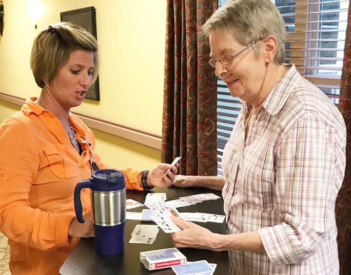 COTA Robin Vigil assists resident at Highline Place Memory Care