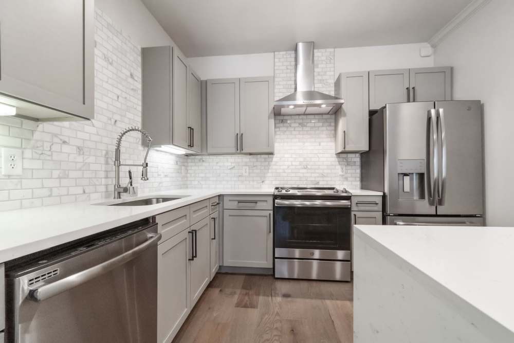 Kitchen with stainless-steel appliances at St. James in Dallas, Texas