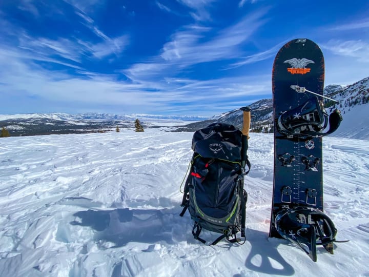 Snowboard standing in the snow