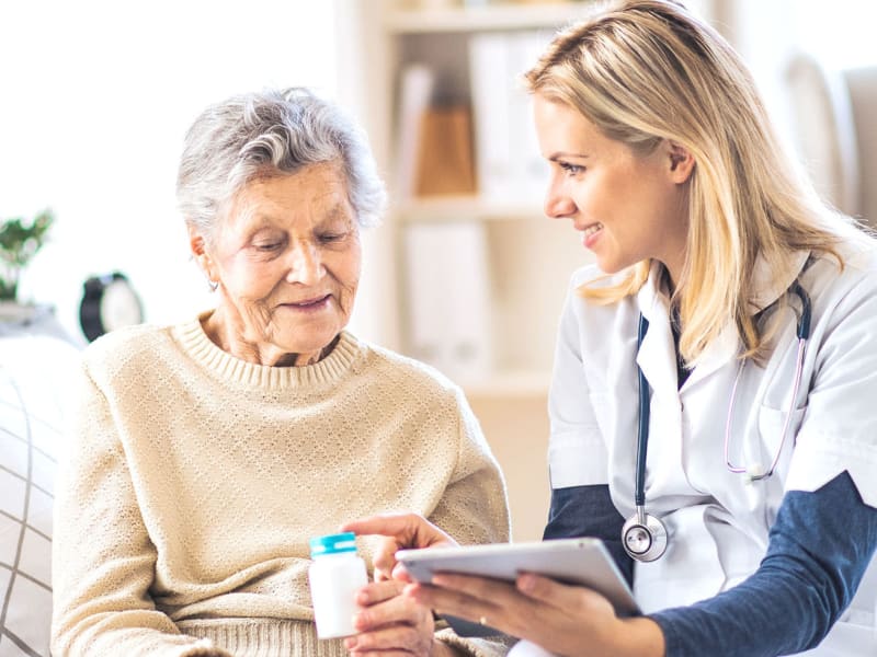 Nurse making a home visit at Bell Tower Residence Assisted Living in Merrill, Wisconsin