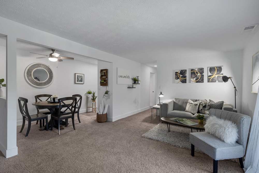 View of the dining area and the spacious living room at Millcroft Apartments & Townhomes in Milford, Ohio