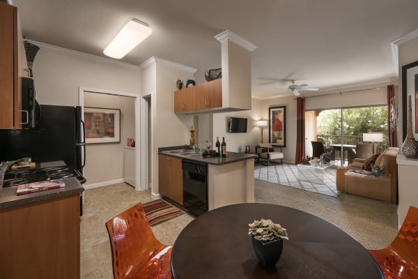 Kitchen leading into the living room at Borrego at Spectrum in Gilbert, Arizona
