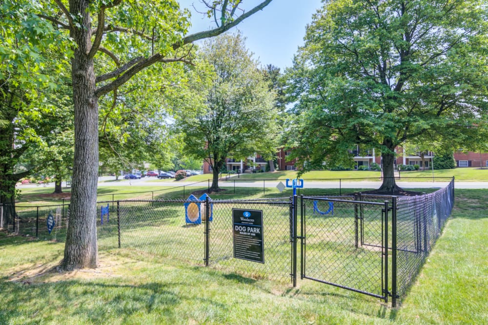Fenced dog park with agility courses at Woodacres Apartment Homes in Claymont, Delaware
