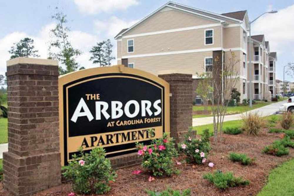 Apartment community entrance sign at Arbors at Carolina Forest in Jacksonville, North Carolina