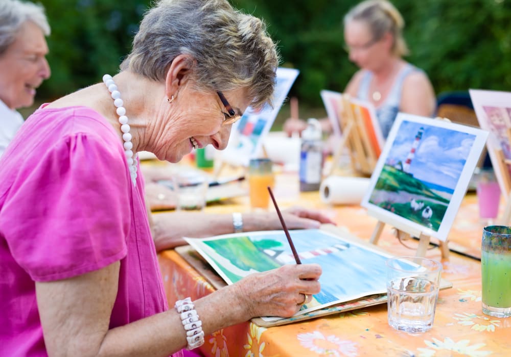 Senior Woman painting at The Village of River Oaks in Houston, Texas