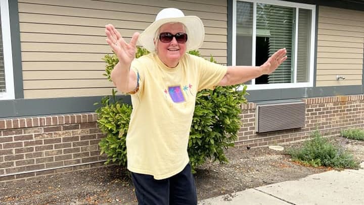 Resident of Harvester Place Memory Care in Burr Ridge Illinois enjoying a sunny day