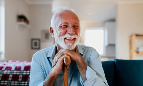 A resident smiling in his home at Merrill Gardens. 