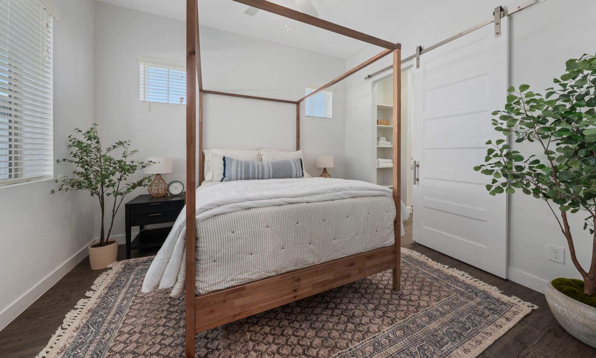 Spacious bedroom with barndoor at EVR Porter in Maricopa, Arizona
