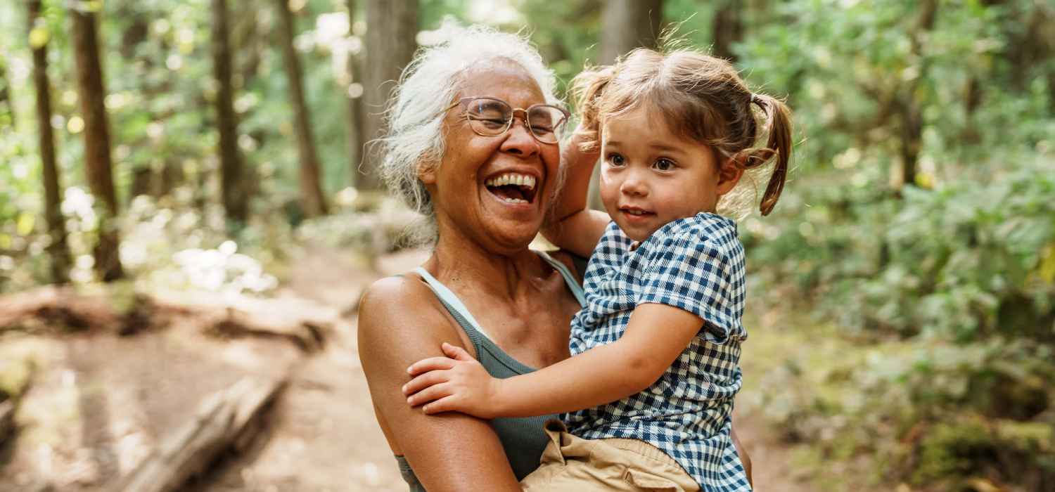 Resident holding her grand daughter at Parkside Commons Apartments in Greenville, North Carolina